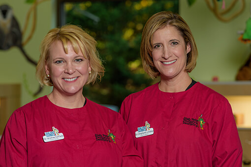 Picture of Dr. Lindsay and Dr. Coffield in red scrubs